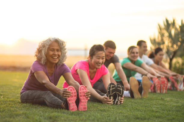 Person doing light stretching outdoors near water